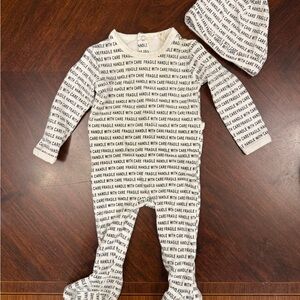 Unbranded White Footed One-Piece with Black Text Print and Matching Hat